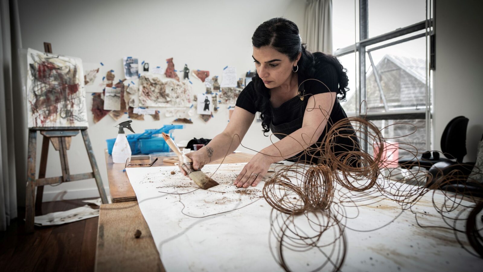 A photo of Negin Chahoud using a paint brush