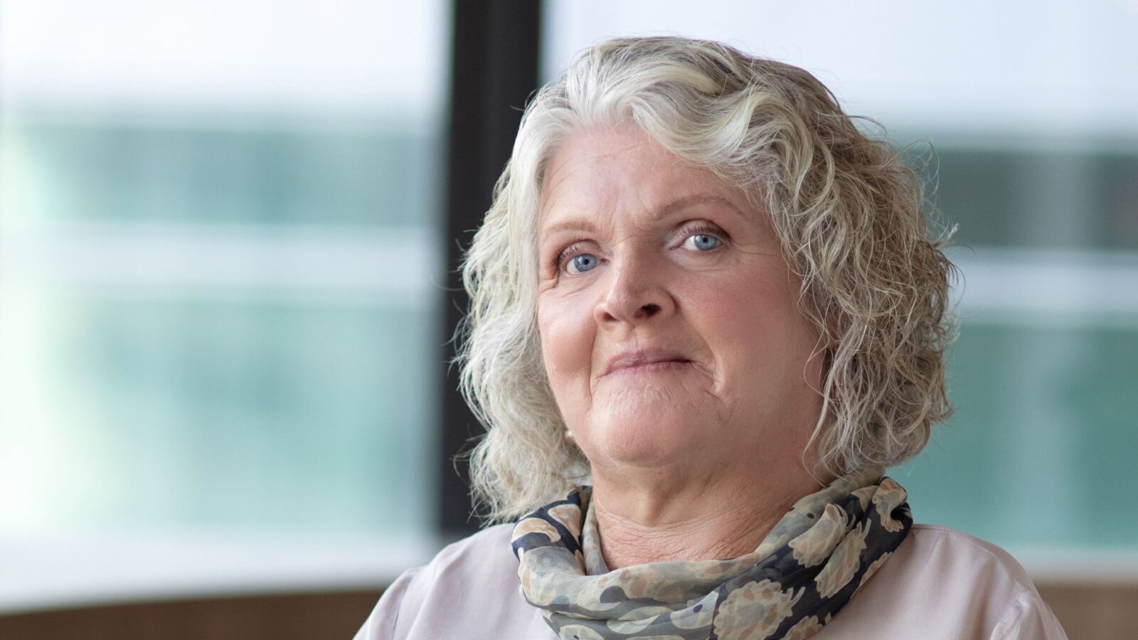 Disability Discrimination Commissioner, Rosemary Kayess, she is smiling and sitting in her wheelchair