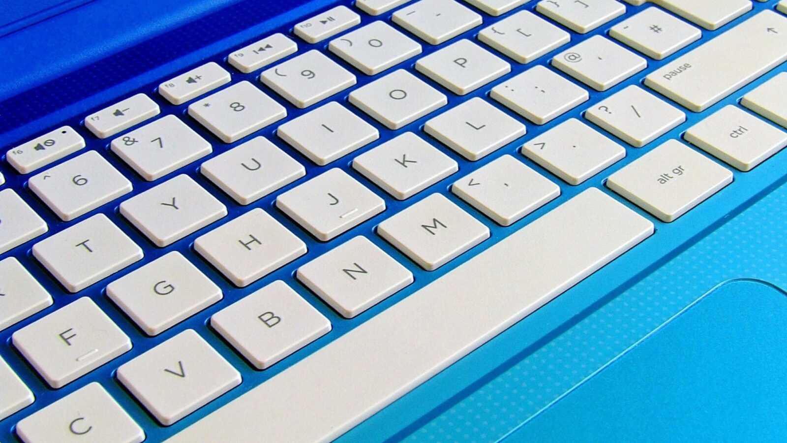 A close up of a white key computer keyboard
