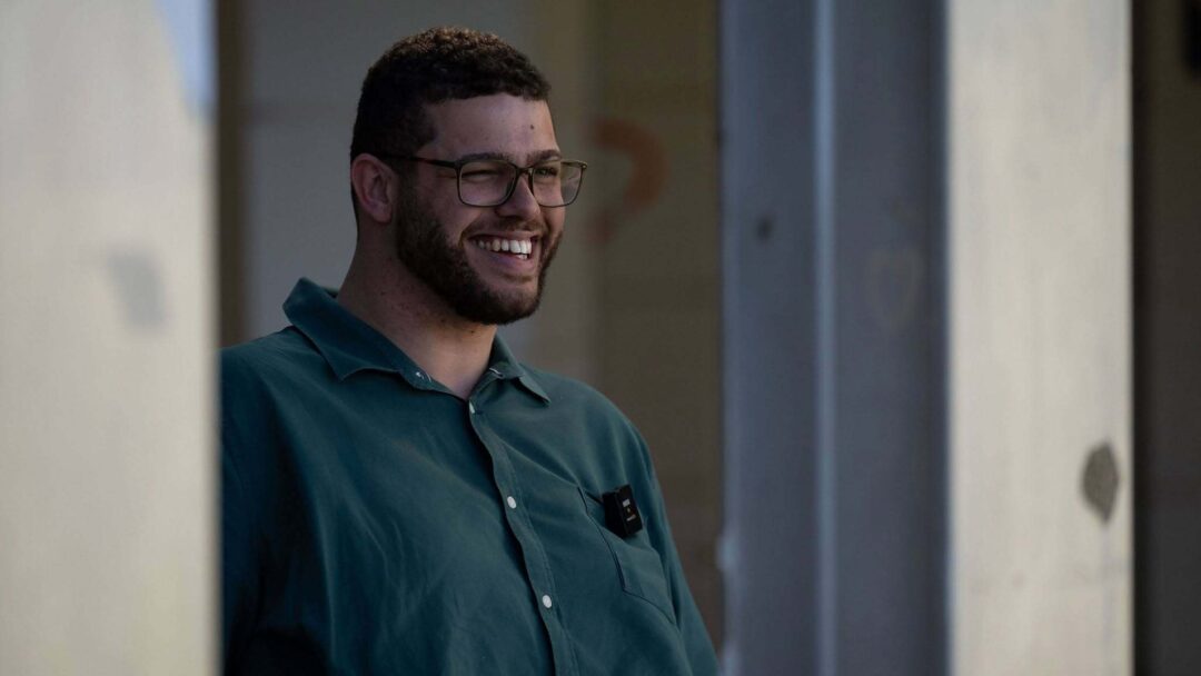Jordan Steele-John smiling, wearing a green shirt
