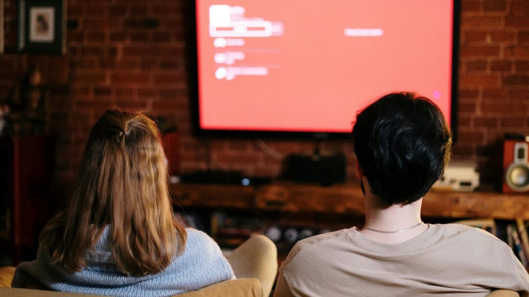 Two people watching tv