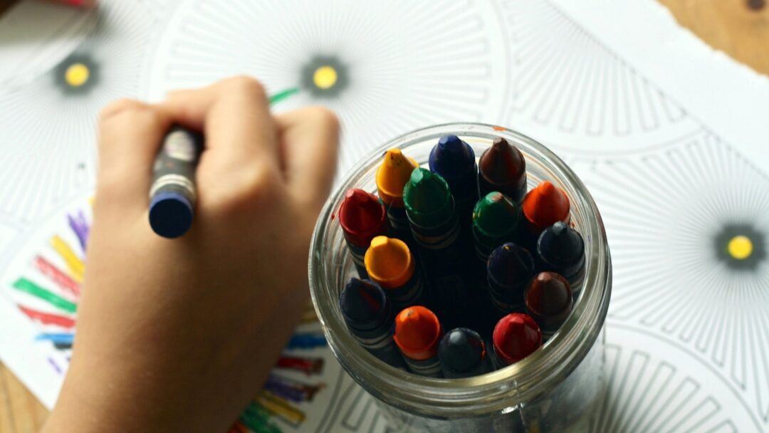 A child holding a crayon