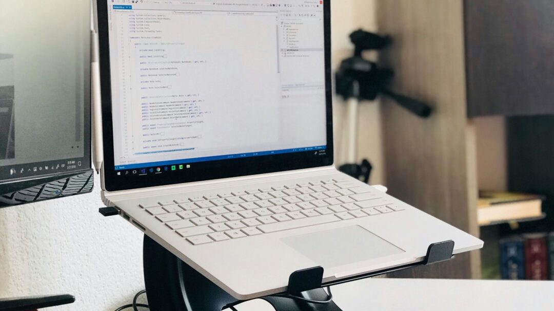 A white laptop on a stand