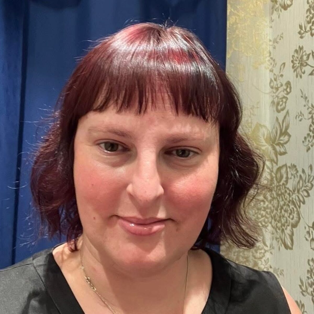 A photo of Jennifer Crowther, a woman with short red hair and rosy cheeks.